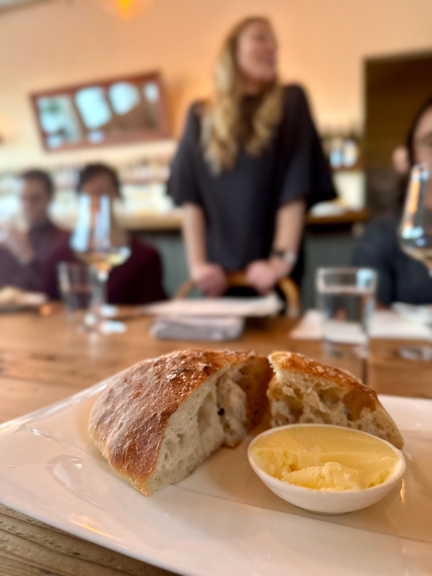 Fresh sourdough and butter paired with wine